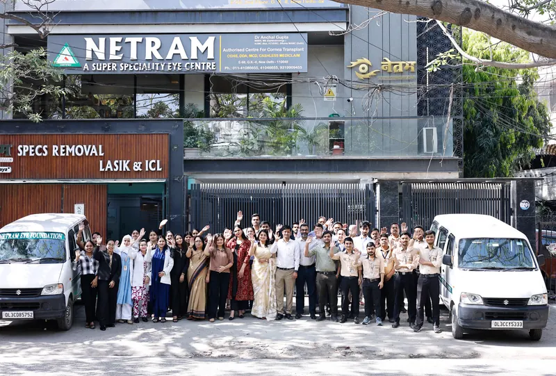The Netram team in front of the Netram building, with the Foundation vans